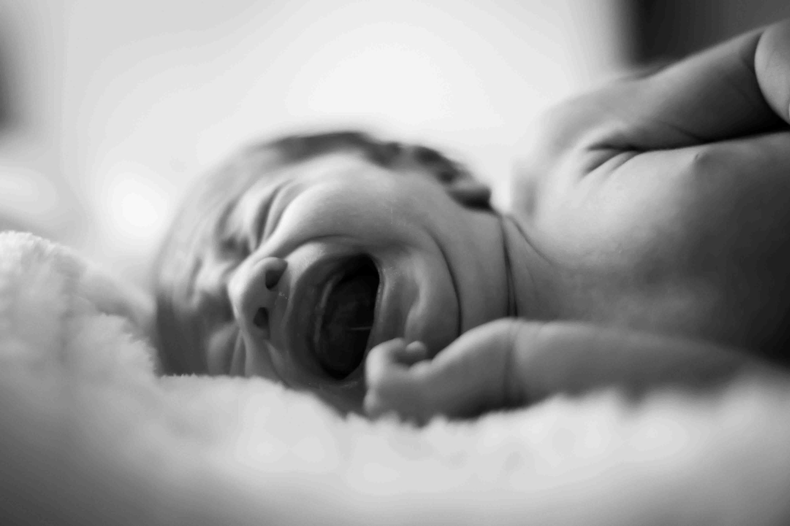 small-vulnerable-newborn-crying